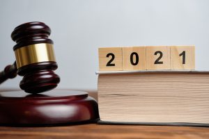 The concept of new laws in 2021 next to the judge hammer
